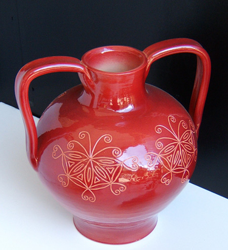 red twin handled pot with mandlala motifs