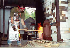 wood fired kiln stoking
