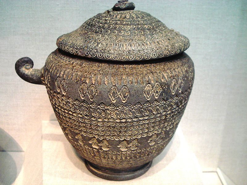 Cinerary_urn,_unglazed_stoneware with incised geometric surface decoartion