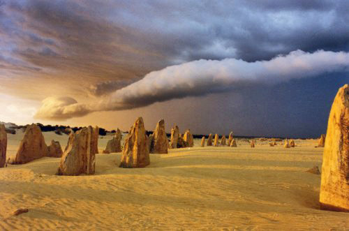 Pinnacles rocks at Western Australia with approaching plume cloud