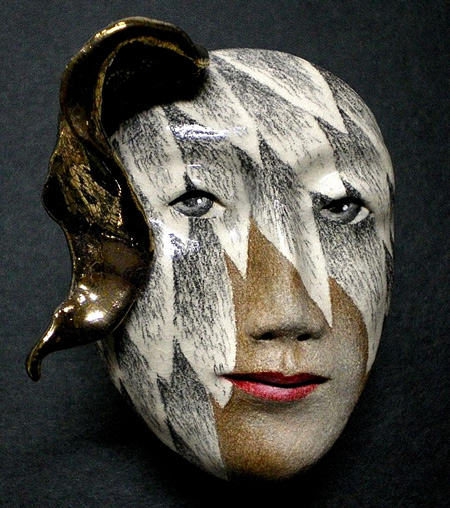 Ceramic masks - Peggy Bjerkan - female mask of woman with a partial wing