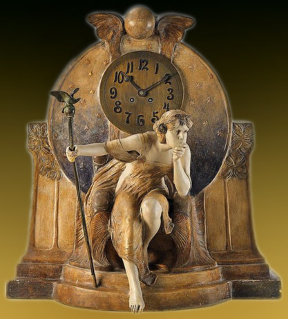 A-Vienna-gilt-ceramic-Théodora-figure-clock.-A-Goldscheider-gilt-and-painted-terracotta-and-bronze-table-clock,-the-movement-with-half-hour-strike-on-spiral-gong---Ca.-1903