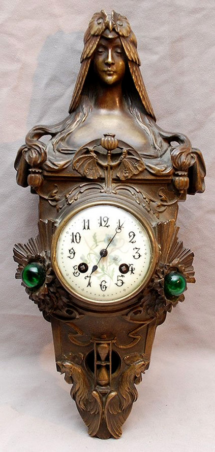Bronze Art Nouveau wall clock with the bust of a lady