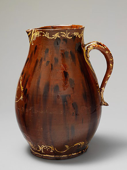 Earthenware pitcher; Redware with slip decoration