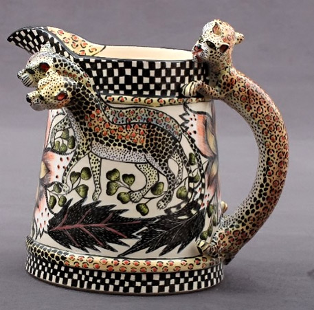 Leopard Jug - black and white chequered base and band around the top rim, leopard handle and figures on the side 