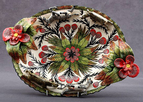 Zebra Rhino Platter - central flower motif with red flower and green leaf handles and rhino and zebra figures on the edge