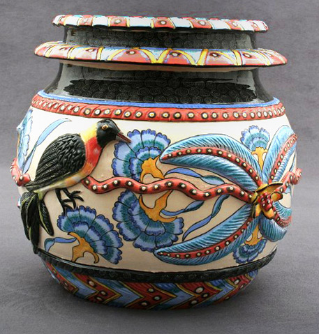Bird Vase Ardmore with raised blue flowers and a black-yellow and red bird
