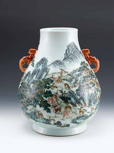 Qianlong Landscape Vase - painted in fencai with a forest full of deer frolicking between green pines and cypresses, cragged rocks and flowing creeks.