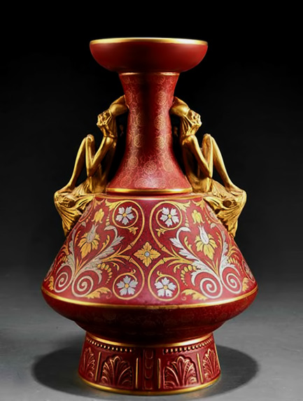 Christopher Dresser Earthenware Vase-by-Old-Hallron-red-ground-with-gold-and-silver-foliate-scrolls,-figural-handles-of-jesters,-height-14-14-in