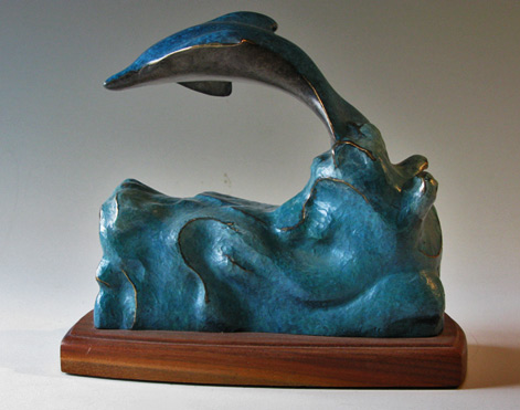 Turquoise flying dolphin figurine on wooden base -Marty-Oppenheimer