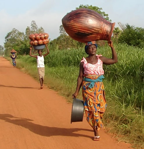 Women transporting pots in Togo , Africa