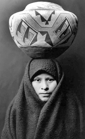 Native American girl with Zuni jar