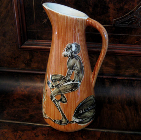 Burnt orange Jug with a dancing Aboriginal motif - Florenz pottery, Australia 1970
