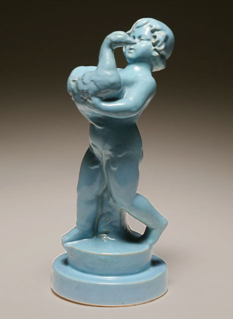 Light blue ceramic figure, boy carrying a duck - Haeger