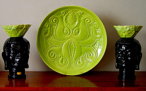 Lime green octopus plate with black tribal heads -- Haegert
