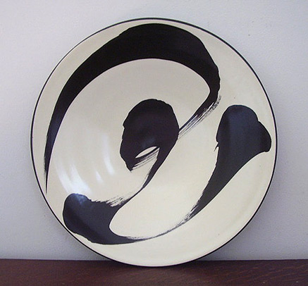 Plate by Ann Mallory lack motif on white