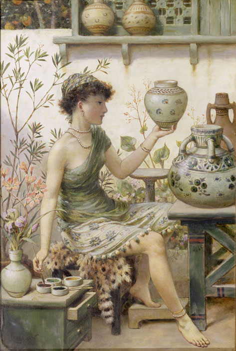 young girl painting pottery