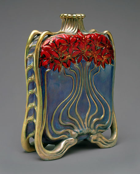 Art Nouveau bronze bottle with red flowers and undulating stems on a blue background