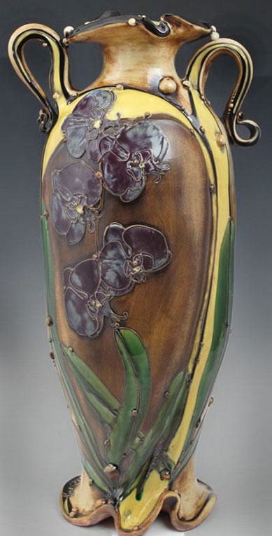 Carol Long Art Nouveau style tall vase with black orchids and yellow, brown and green
