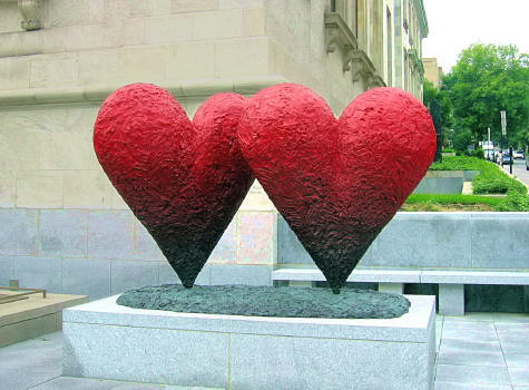 Outdoor twin red heart sculpture