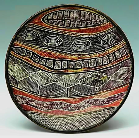 Carl Cooper dish with Aboriginal style unglazed sgraffito decoration
