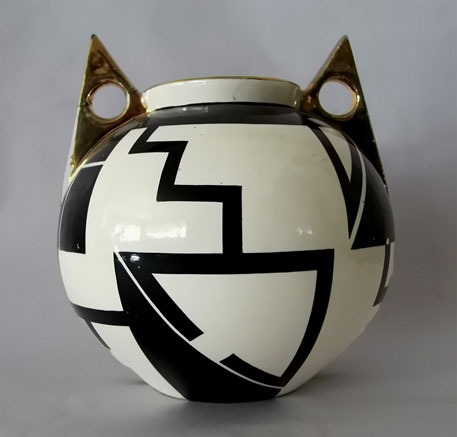 Art Deco vase, decorated with spherical, geometric black graphics.