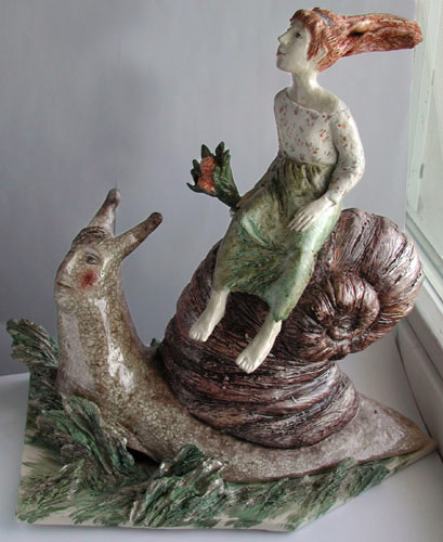 Ceramic sculpture of a girl riding a snail by Marina Nelyubina