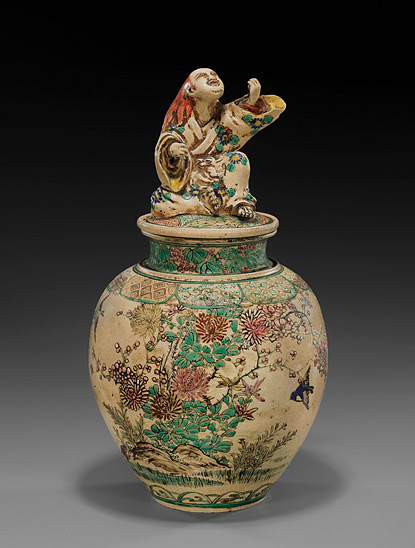 Chinese jar with chrysanthemum flowers and figurine lid