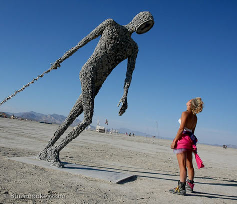 Large sculpture of a walking man - Burning-Man-2009