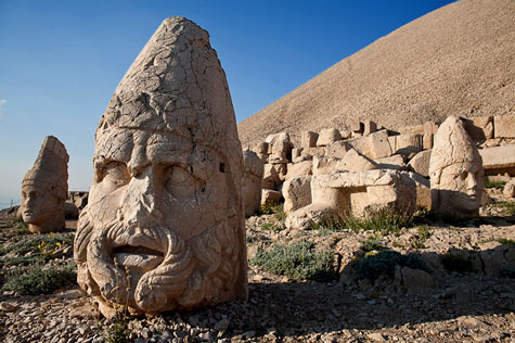 Sculptured stone head on a Turkish landscape