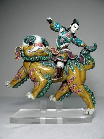 Chinese-polychrome tile - man riding a foo dog