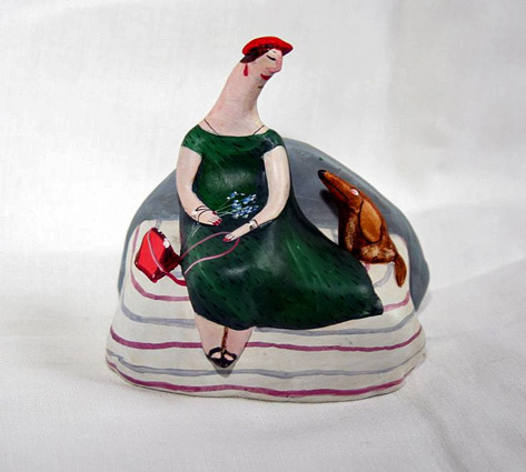 E.Nevinnaya--ceramic figurine - lady on sofa with pet dog