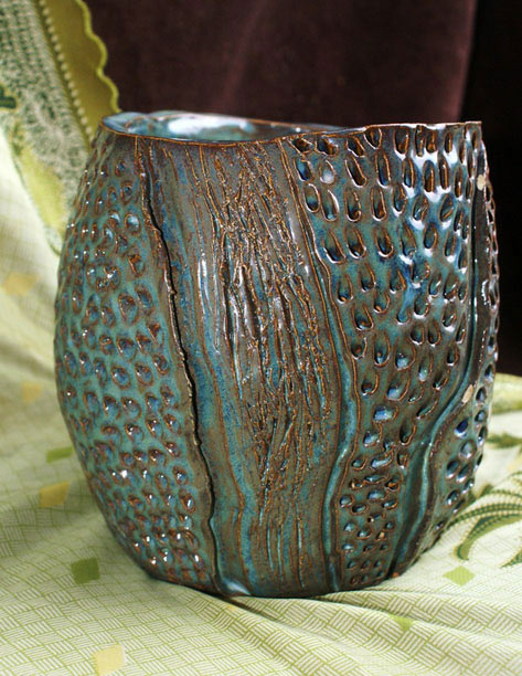 Turquoise vessel with incisions and strong textures
