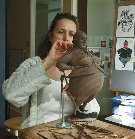 Cecile-Picard modeling a clay firgurine