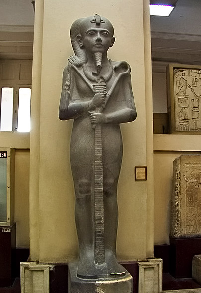 Grey-granite-statue-of-the-god-Khonau,-the-child-of-the-Theban-Trinity,-his-parents-being-Amen-Re-and-Mut