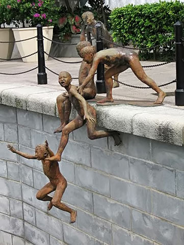 Chong Fah Cheong public sculpture of four boys playing at the pool