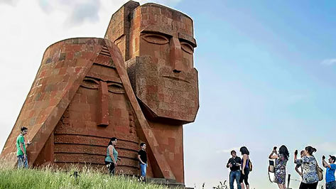 Tourists-visit-the-Grandmother and Grandfather monument outside the city of Stepanakert 