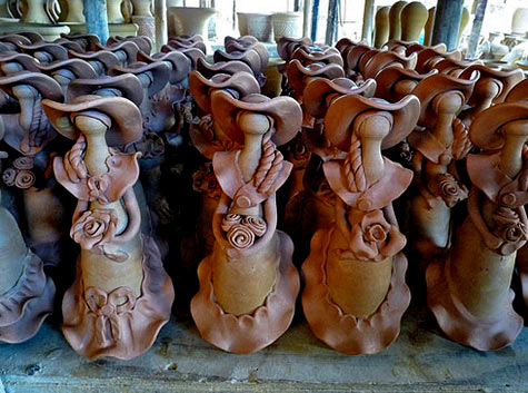 Figurine factory with female figurines holding roses