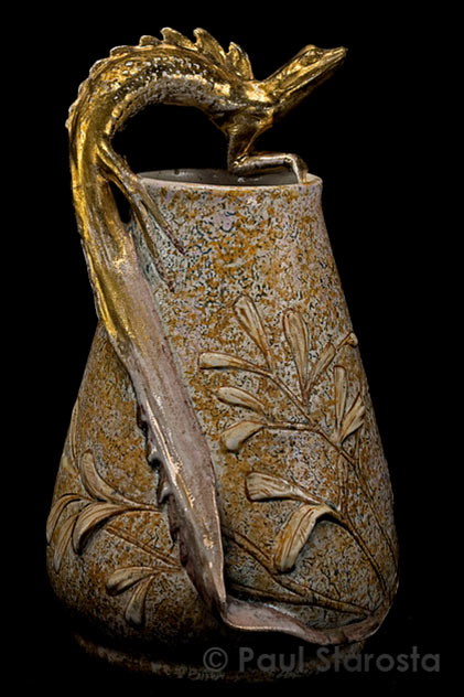 Amphora vase with lizard figure and botanical relief