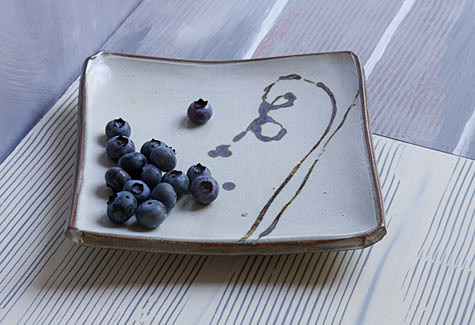Square dish and blueberries