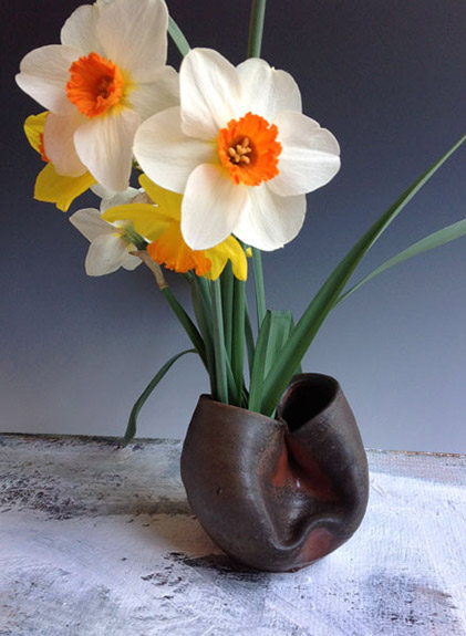 Daffodills in folded vase