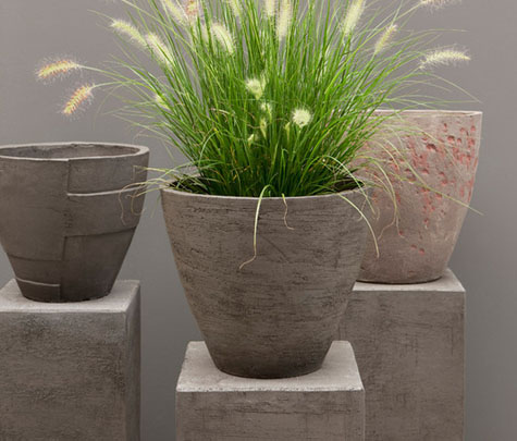 Atelier Vierkant - three planters on pedestals