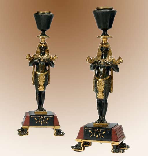 Pair-of-French-gilt-and-patinated-Egytpian-styled-candle stands