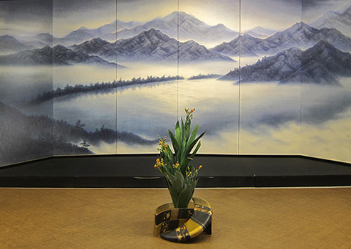Japanese folding screen and floral arrangement