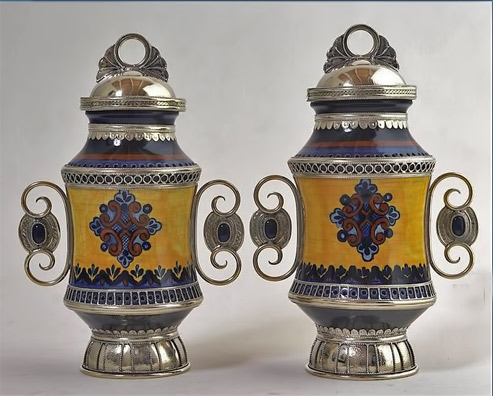 Jesus Guerrero Santos two matching vessels with ceramic body and silver lid, handles and base