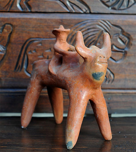 man riding a bull candle holder