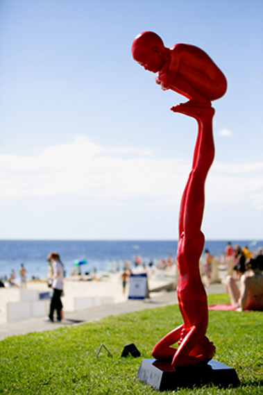 Chen Wenling-Games-sculpture photo by Jarrad Seng Two red figures balancing acrobats