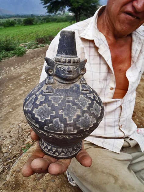 Local-farmer-with-ancient-(pre-Incan-Moche-culture)-pottery-he-found-while-working-in-his-fields