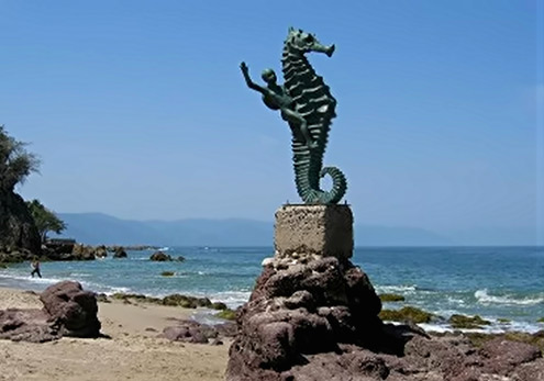 Los Muertos Beach Sculpture of a boy riding a seahorse