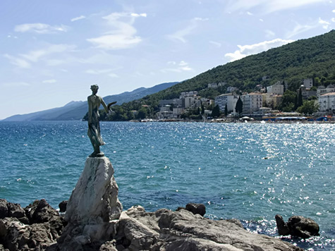 Opatija Statue standing female sculpture overlooking a harbour